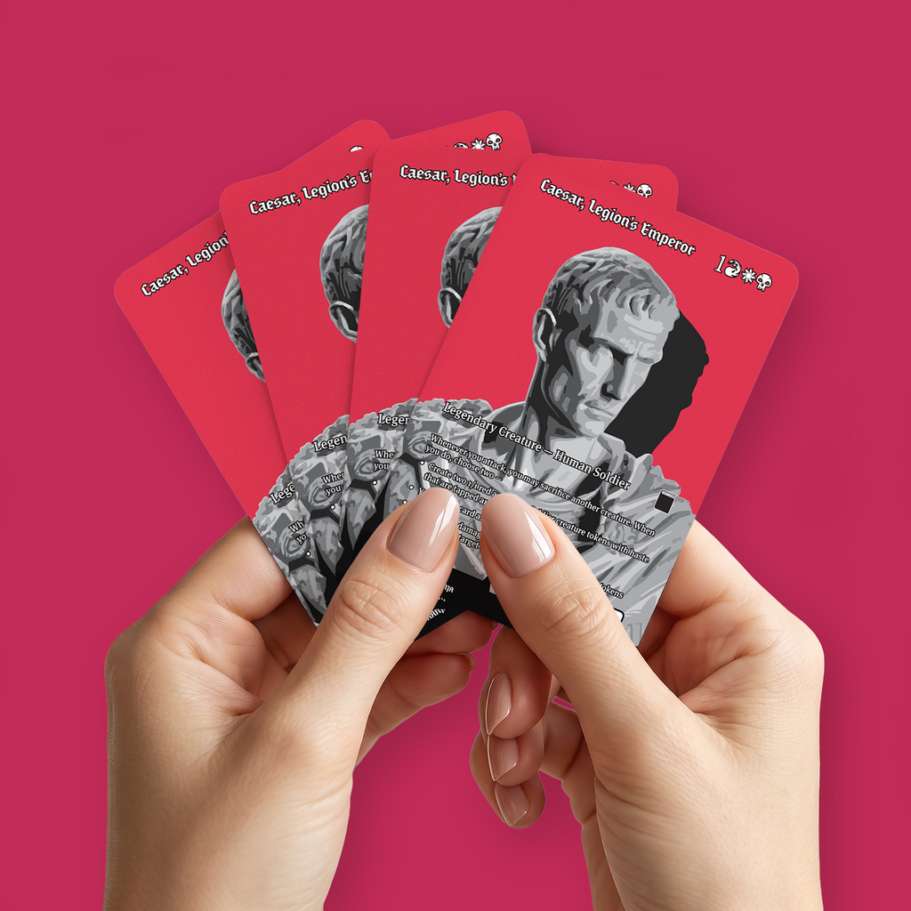 A pair of hands holding a fan of custom proxies titled "Caesar, Legion's Emperor" on a pinkish-red background.