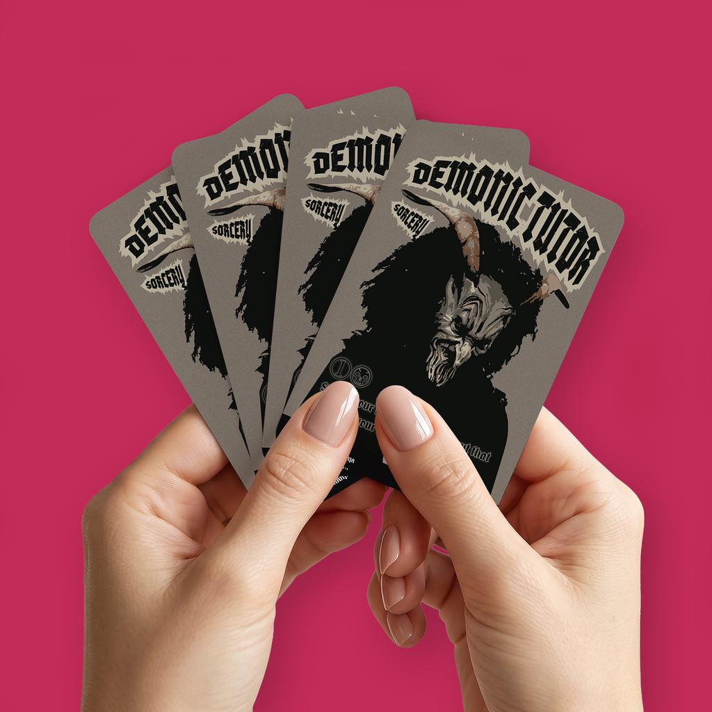 A pair of hands holding a fan of custom proxies titled "Demonic Tutor" on a pinkish-red background.