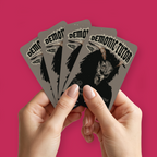 A pair of hands holding a fan of custom proxies titled "Demonic Tutor" on a pinkish-red background.